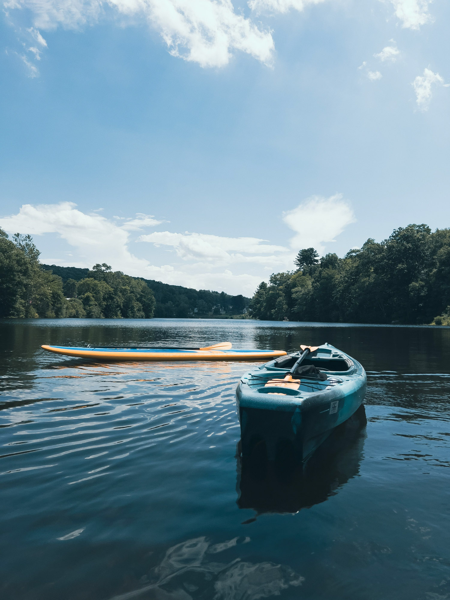 Kayak and paddleboard on a lake