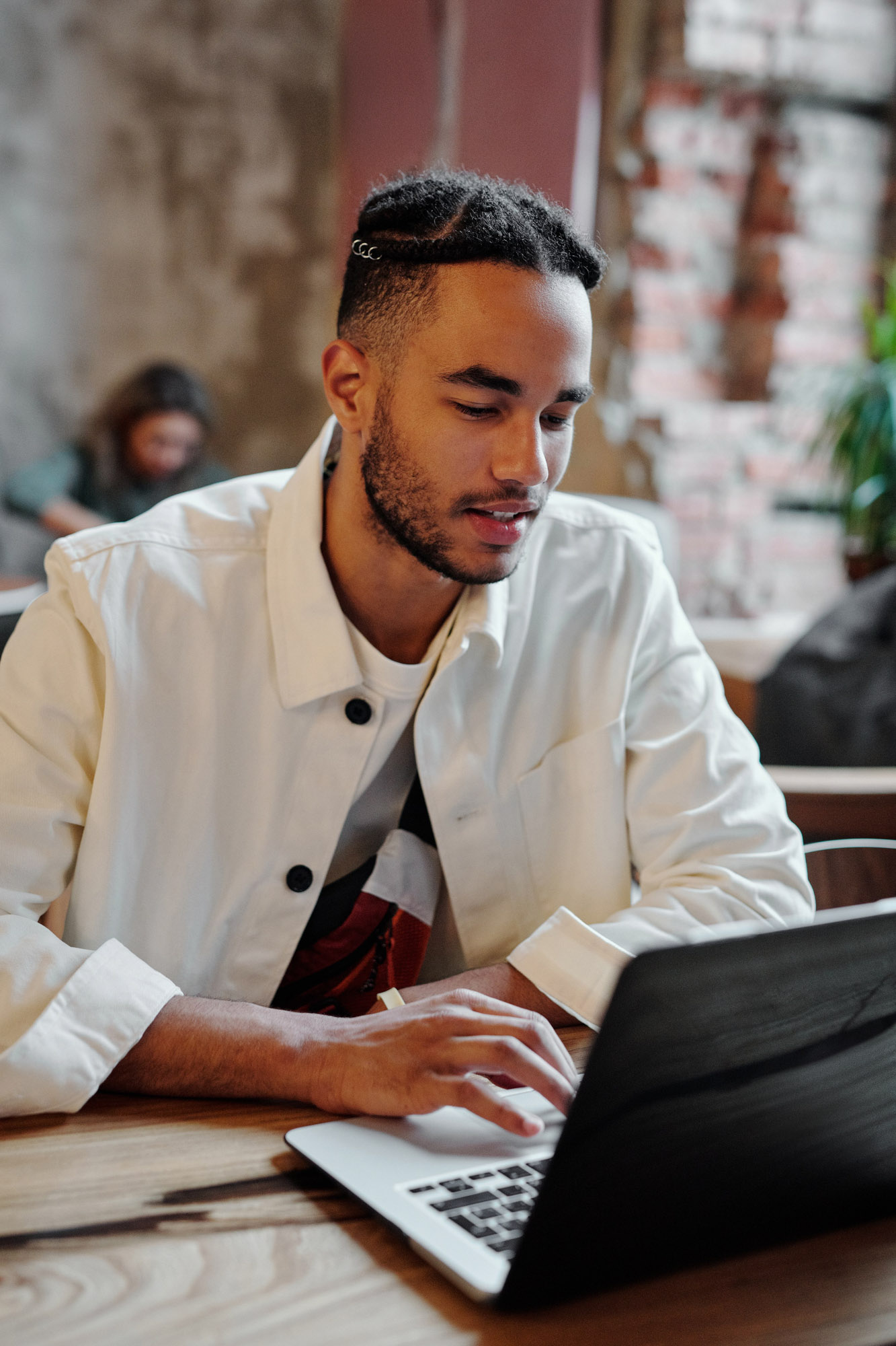 Young man studying on his laptop